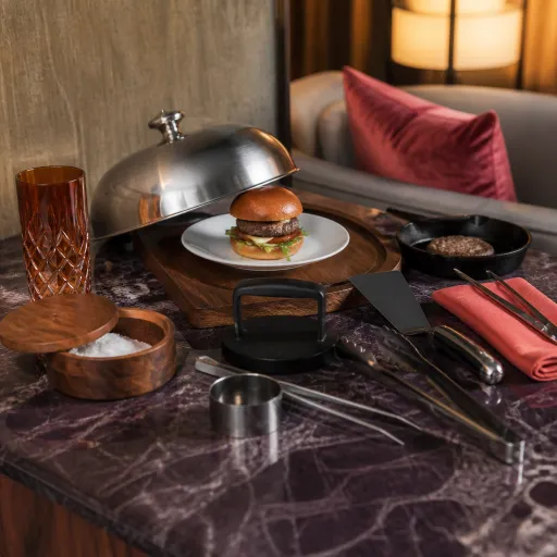 From palace suites to Jimbo’s Hamburger Palace: how luxury travelers crave elevated comfort food